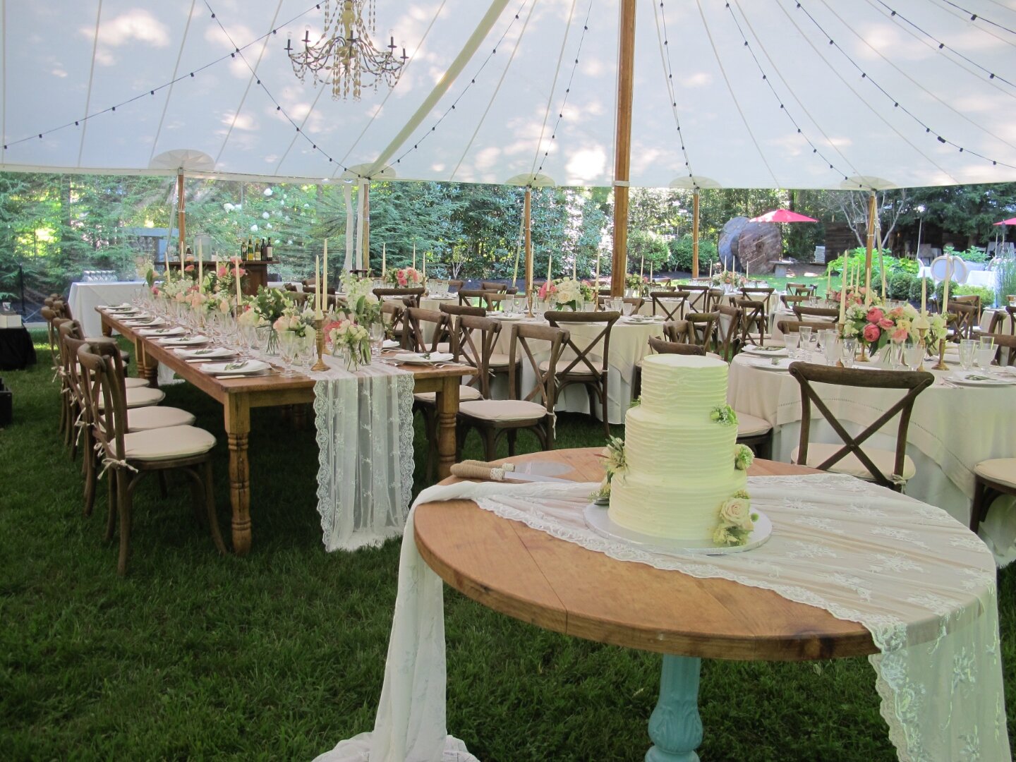 Crystal chandelier above a wedding reception table at The Château On The Lake