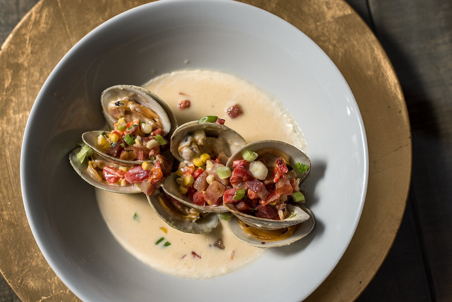 Steamed clams in white wine broth with herbs