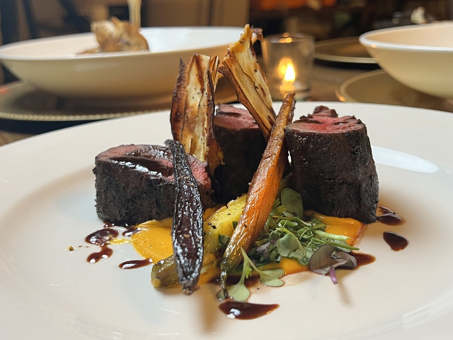 Roasted venison loin with red wine reduction